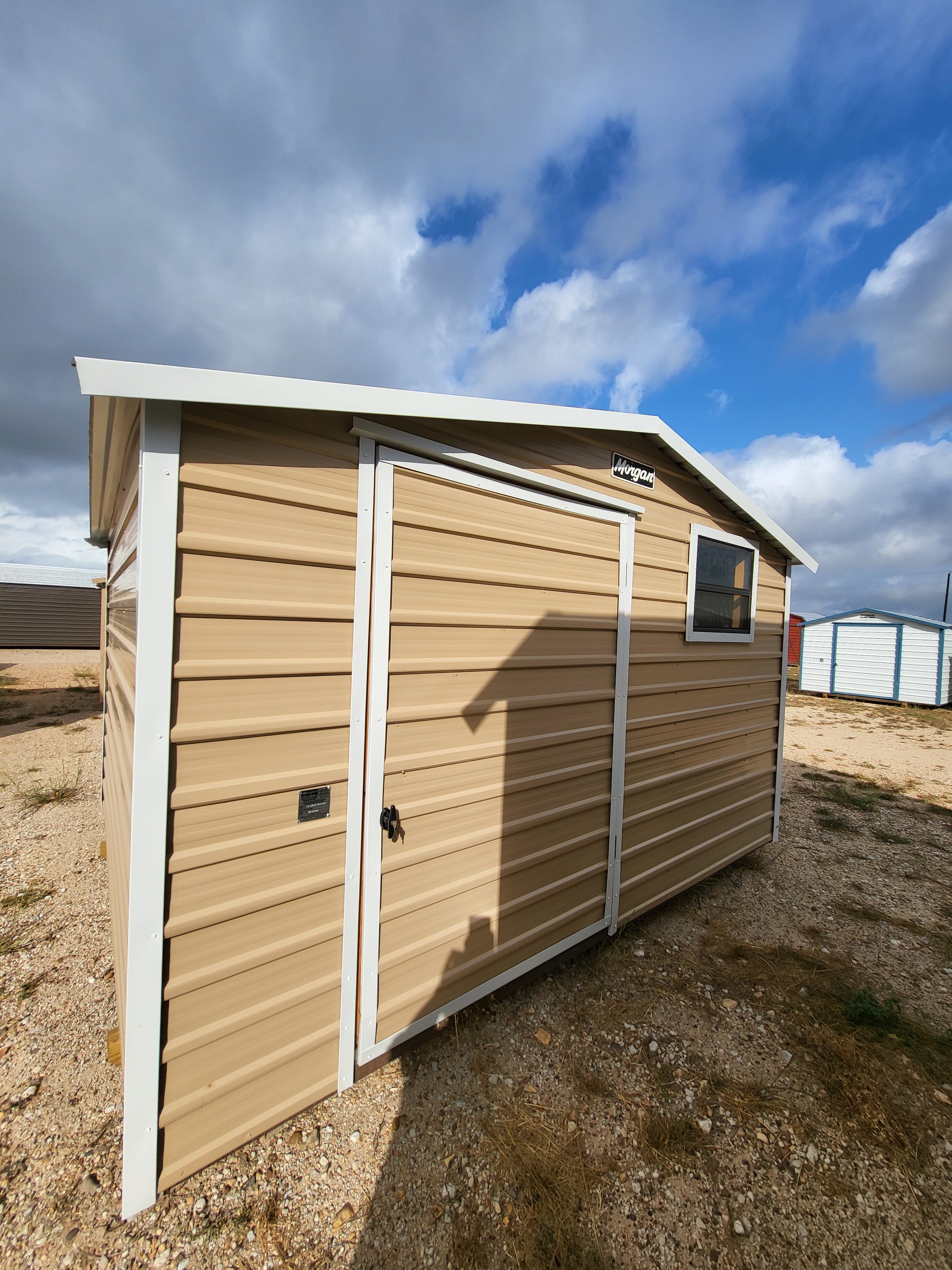 10 x 12 Peak Storage in Tan Steel with White Trim and Window - H205462